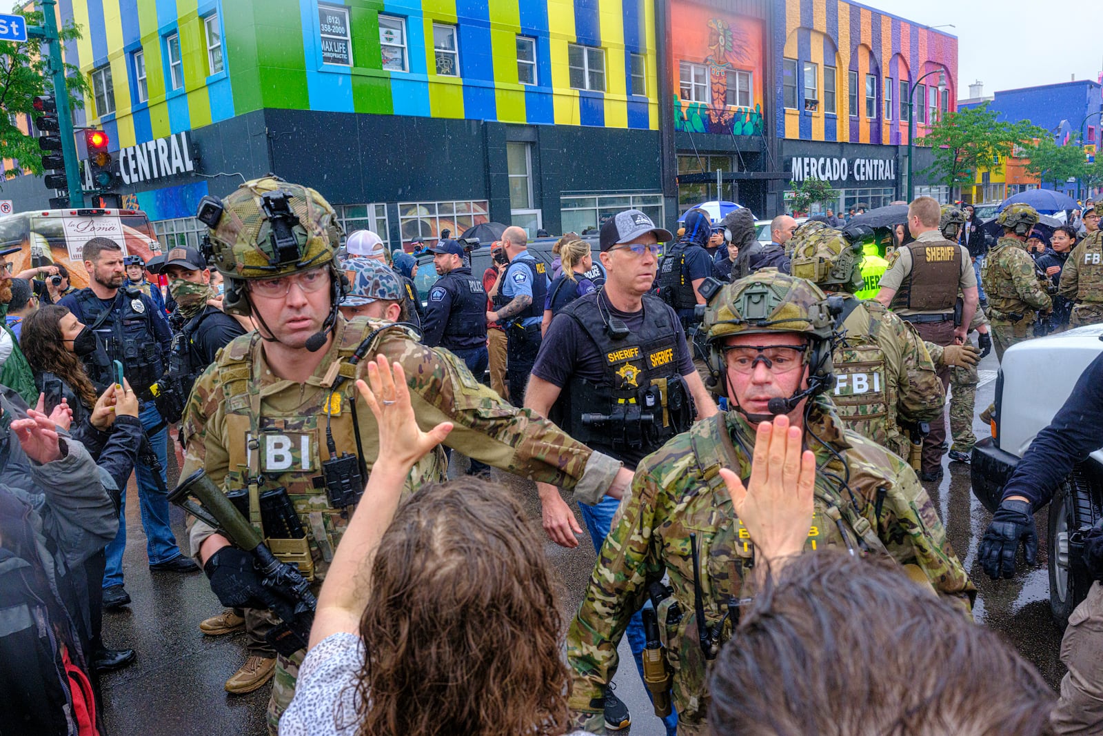 ICE, ATF, and FBI officers are seen as tensions escalate between community members and federal agents following an operation, Tuesday, June 3, 2025, in Minneapolis, Minn. (Kerem Yücel/Minnesota Public Radio via AP)