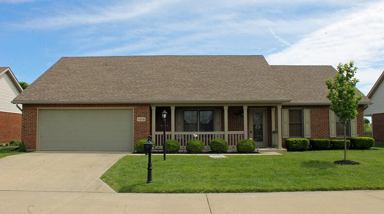 A covered front porch adds both curb appeal and additional outdoor living space to the 1,830-square-foot, detached condominium. CONTRIBUTED PHOTOS BY VICKIE KAPNAS