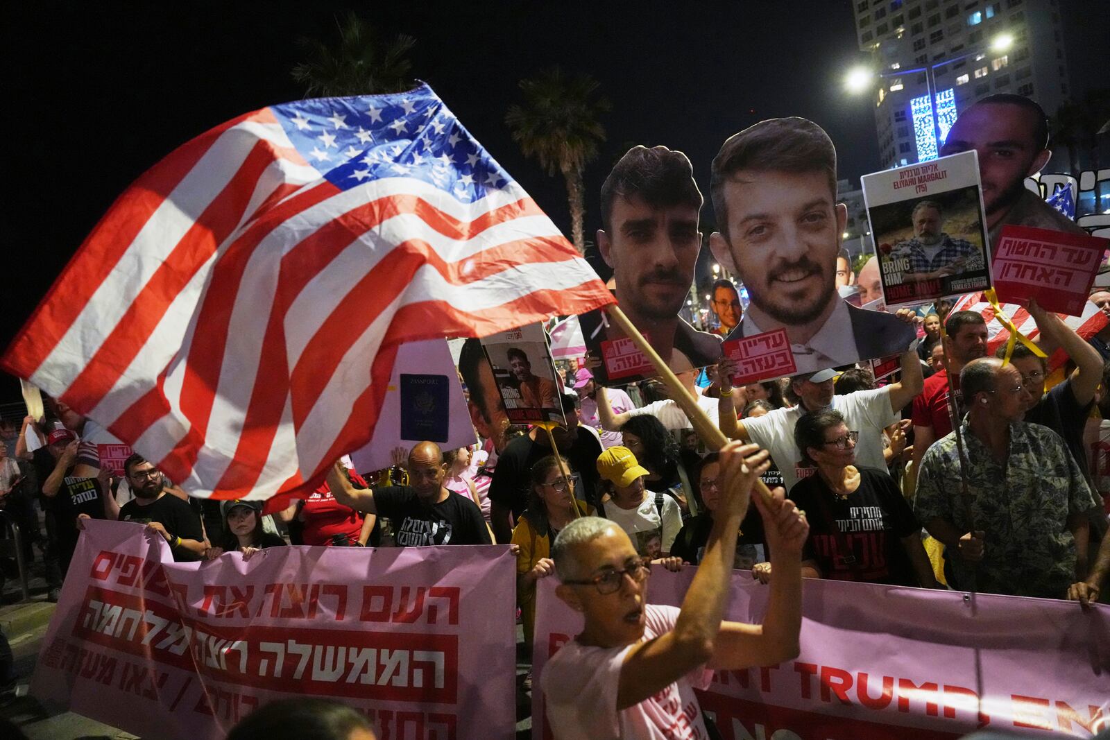 Israelis protest outside the U.S. Embassy Branch Office in Tel Aviv on Tuesday, May 13, 2025, demanding the release of hostages held by Hamas in the Gaza Strip. (AP Photo/Ariel Schalit)