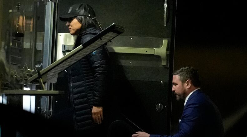 Director of National Intelligence Tulsi Gabbard, left, and FBI Deputy Director Andrew Bailey, enter a command vehicle as the FBI takes Fulton County 2020 Election ballots, Wednesday, Jan. 28, 2026, in Union City, Ga., near Atlanta. (AP Photo/Mike Stewart)