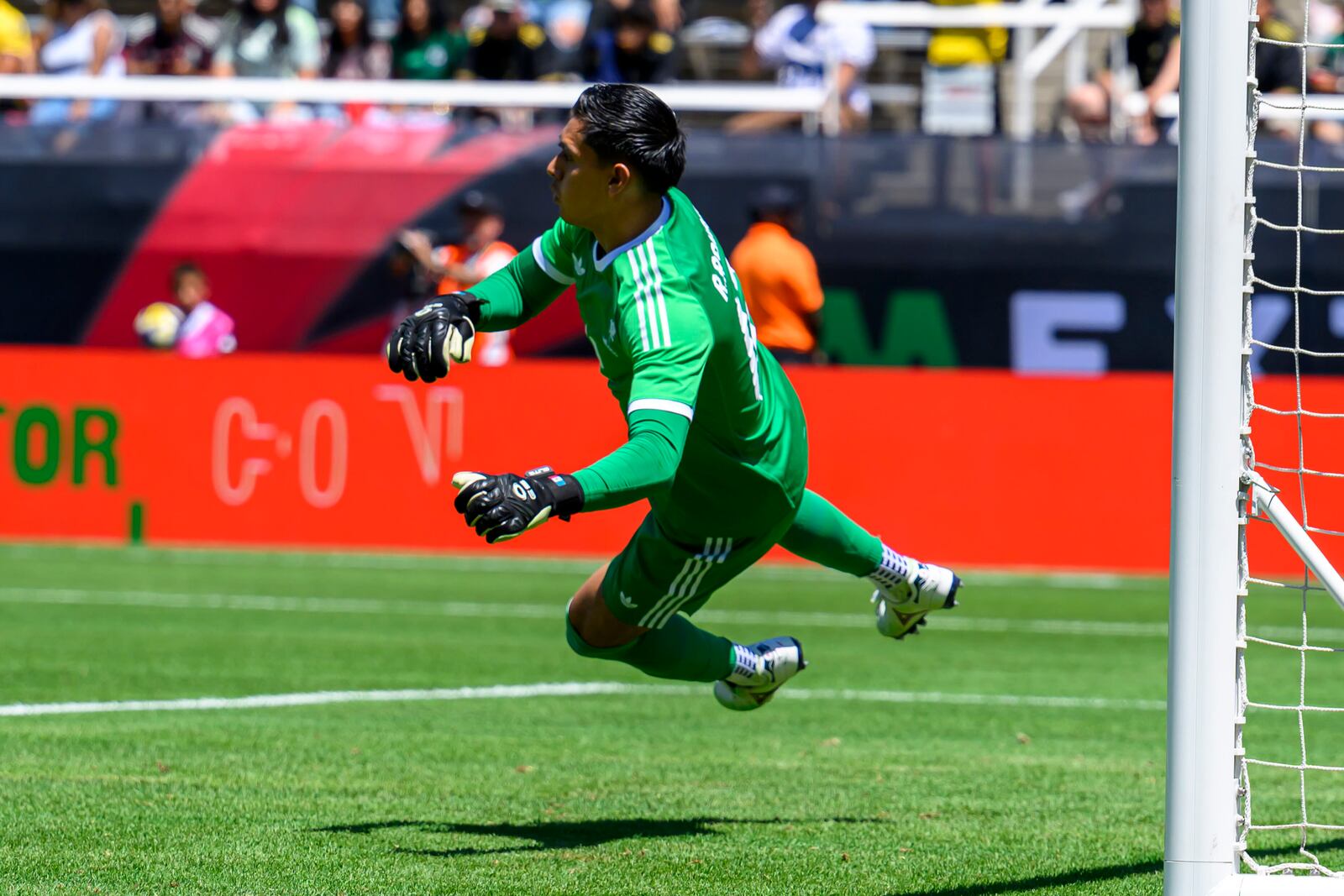 Mexico's José Raúl Rangel (12) dives to stop the ball during an international friendly soccer match against Switzerland, Saturday, June 7, 2025, in Salt Lake City, Utah. (AP Photo/Tyler Tate)