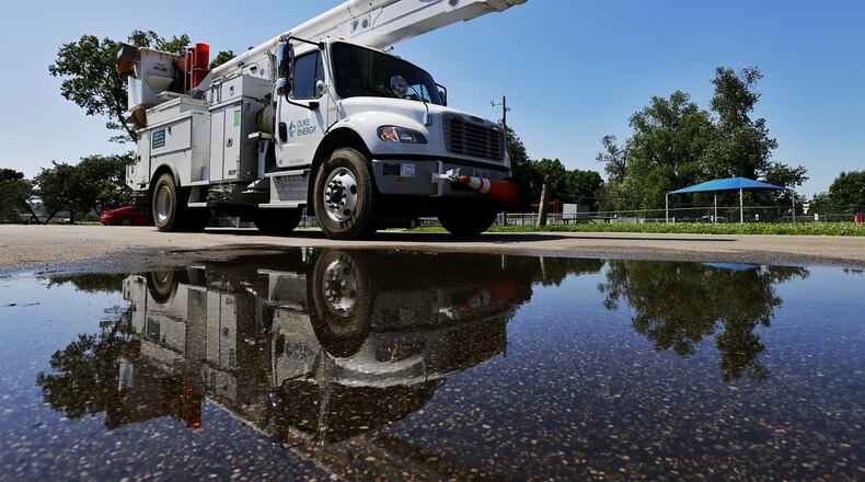 A Duke Energy power crews responds to downed power lines in Butler County in September 2022. NICK GRAHAM/FILE