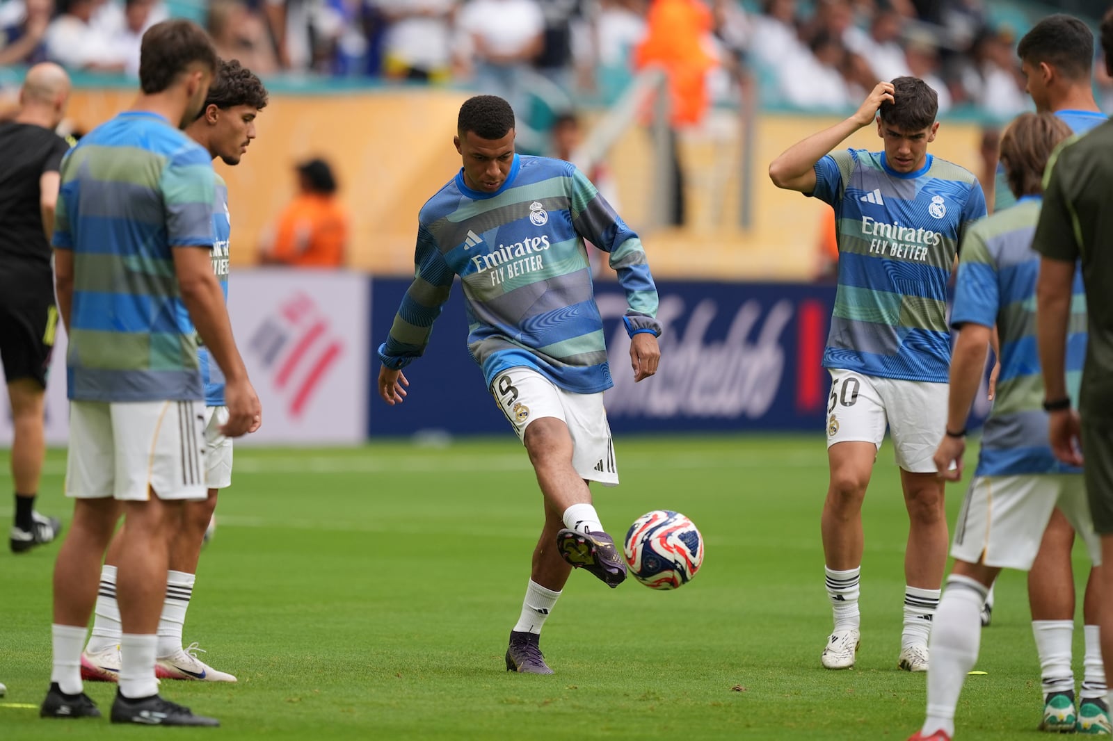 Real Madrid's Kylian Mbappe warms up for the Club World Cup round of 16 soccer match between Real Madrid and Juventus in Miami Gardens, Fla., Tuesday, July 1, 2025. (AP Photo/Rebecca Blackwell)