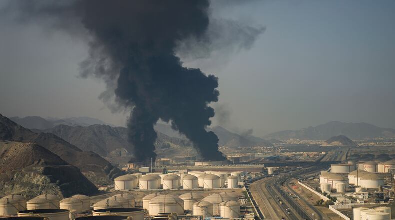 Fire and plumes of smoke rise from an oil facility in Fujairah, United Arab Emirates, Saturday, March 14, 2026. (AP Photo/Altaf Qadri)