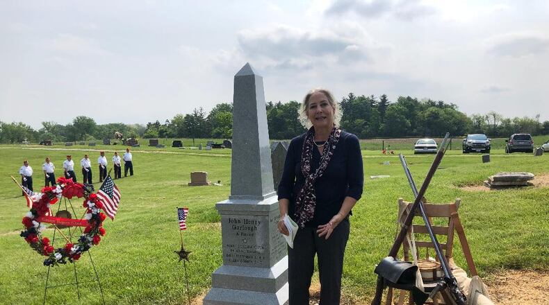 A new marker honoring Revolutionary War veterans and father and son John H. Garlough and John Garlough Jr. was dedicated on Saturday at Garlough Cemetery in Green Township. Lori Garlough of Florida represented her father-in-law Dr. Robert Garlough, who funded the new marker and led the dedication. Local members of the Sons of the American Revolution, Daughters of the American Revolution and Marine Corps League Honor Guard supported the ceremony.