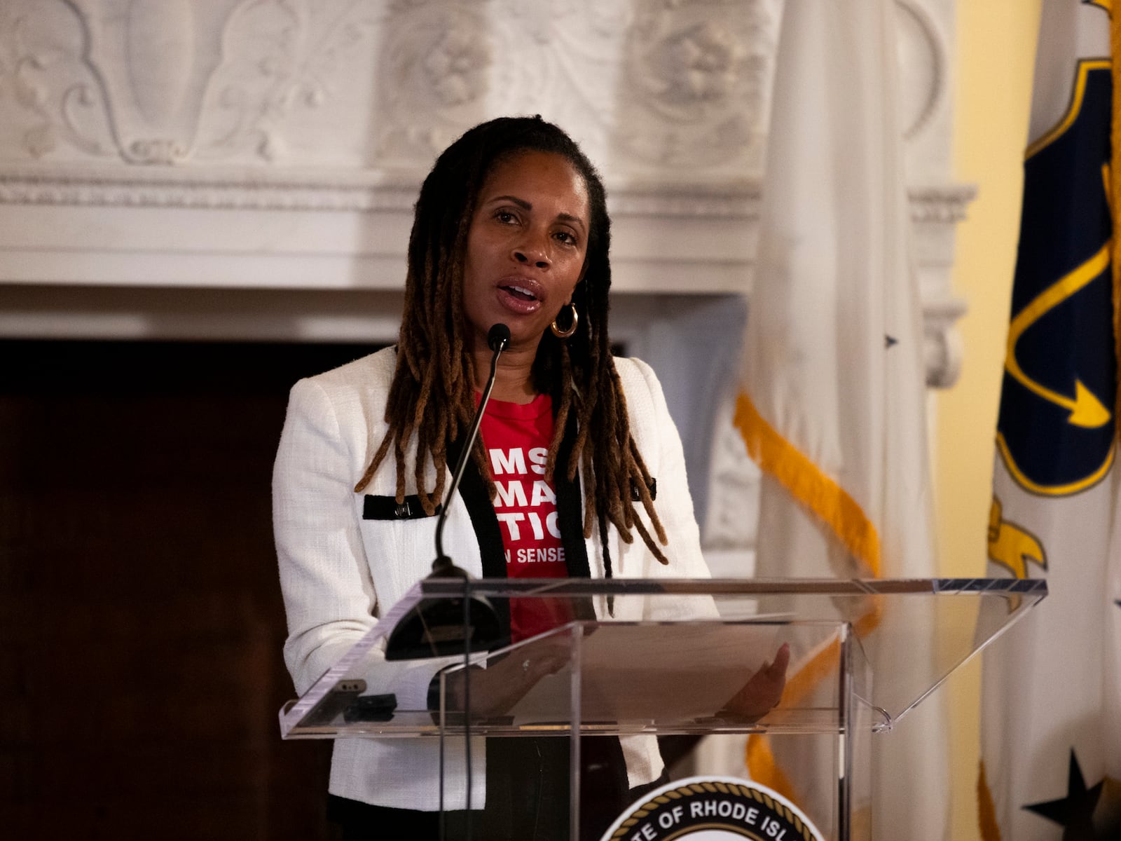 Angela Ferrell-Zabala, executive director of Moms Demand Action, addresses a crowd gathered to witness Rhode Island Gov. Dan McKee sign a bill that bans the sale of assault-style weapons in the state of Rhode Island at the Rhode Island Statehouse in Providence, Thursday, June 26, 2025. (AP Photo/Sydney Roth)