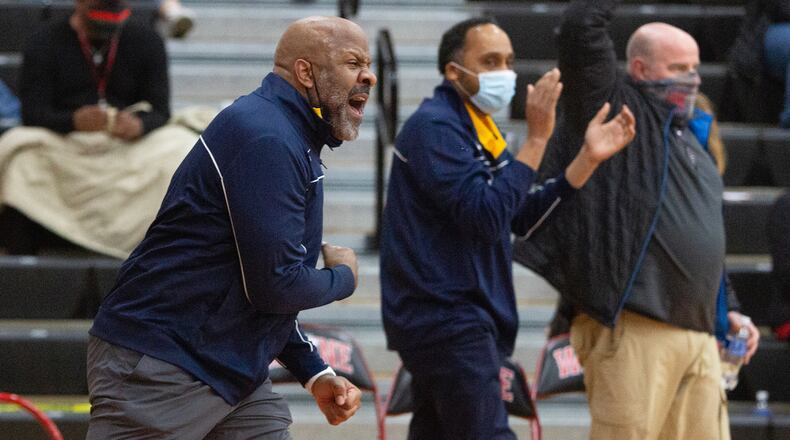 Springfield coach Shawn McCullough reacts to his team's 59-57 victory at ninth-ranked Wayne Friday night. Jeff Gilbert/CONTRIBUTED