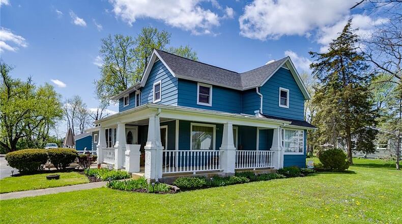 The renovated, 4-bedroom farmhouse offers about 2,480 sq. ft. of living space. The 2-story home is set on a 1.73-acre lot and features wrap-around front and side porches. CONTRIBUTED PHOTO