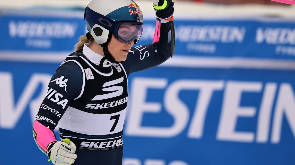 United States' Lindsey Vonn celebrates at the finish area of an alpine ski, women's World Cup Super G, in Tarvisio, Italy, Sunday, Jan. 18, 2026. (AP Photo/Marco Trovati)