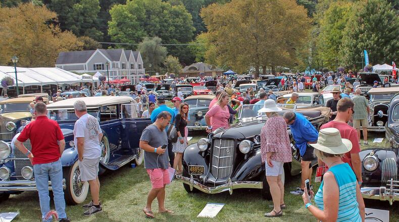 Spectators look over the 1935 Auburn 835 automobile at the 2019 Dayton Concours d’Elegance entered by Michael Mereness of Cincinnati. Photo by Haylie Schlater