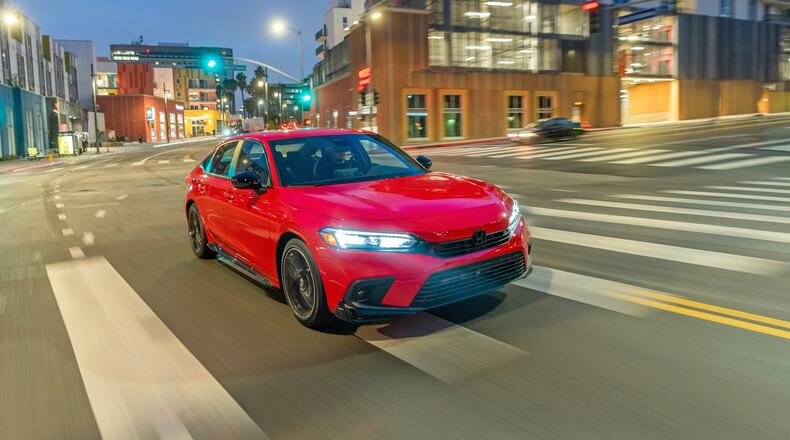 This undated photo provided by Honda shows the 2022 Honda Civic, which is the Edmunds Top Rated Sedan. It has more subdued styling in its current 11th generation and offers an exceptionally quiet cabin alongside a rich set of features. (Courtesy of American Honda Motor Co. via AP)