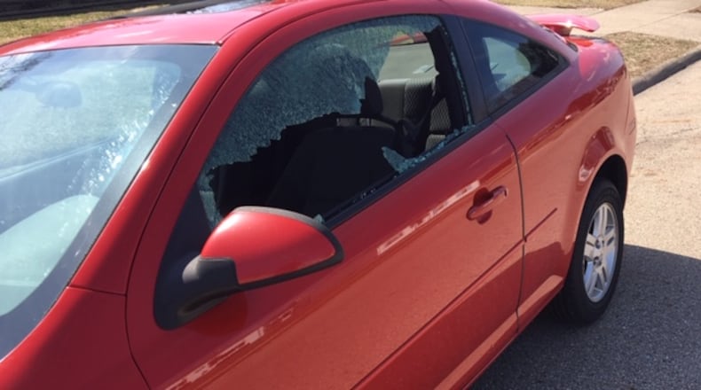 Springfield Police received at least 20 reports of car windows being shot at sometime between Monday night and early Tuesday morning. They are receiving additional reports from residents. JENNA LAWSON/STAFF.