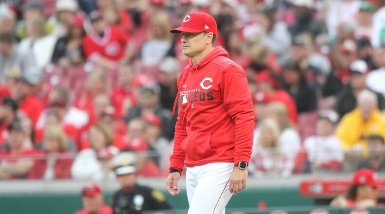 Reds manager David Bell walks to the mound to make a pitching change in the ninth inning on Opening Day on March 28, 2019, at Great American Ball Park in Cincinnati.