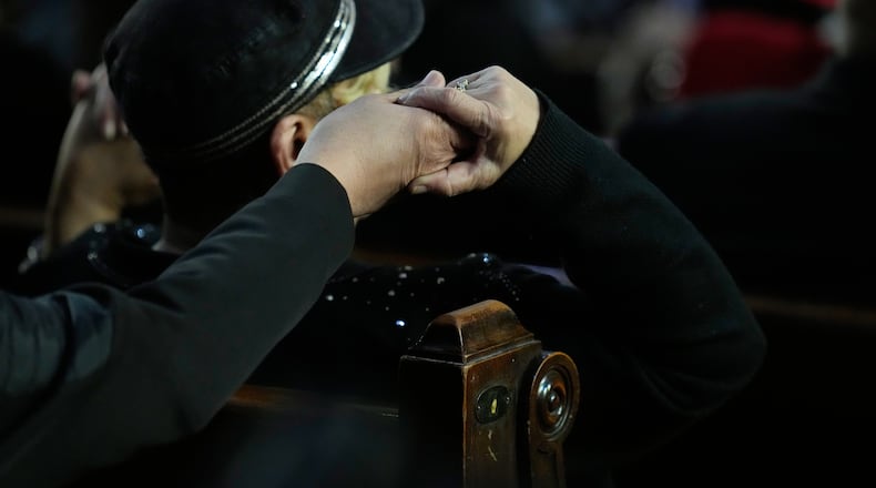 A visitor listens during the Homegoing Celebration of Life for the Rev. Jesse Jackson, Saturday, March 7, 2026, at Rainbow PUSH Coalition headquarters in Chicago. (AP Photo/Erin Hooley)