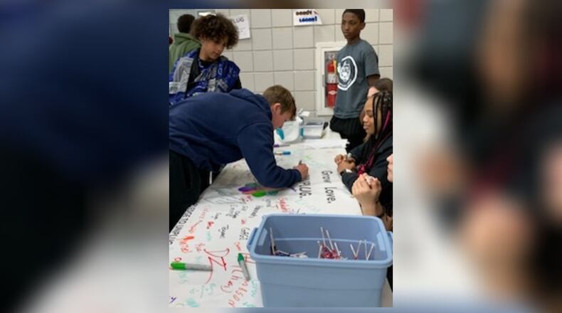 Roosevelt Middle School students sign up to participate in National Day of Unplugging, lasting from sundown Friday to sundown Saturday. They pledge to leave their electronic devices off during the 24 hours and concentrate on interacting with family and others.