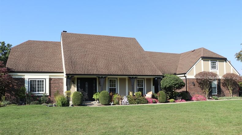 Listed for $499,900 by Keller Williams Home Town Realty, the Tudor two-story home at 2780 Broken Woods Drive has about 4,072 square feet of living space. Contributed photos by Kathy Tyler