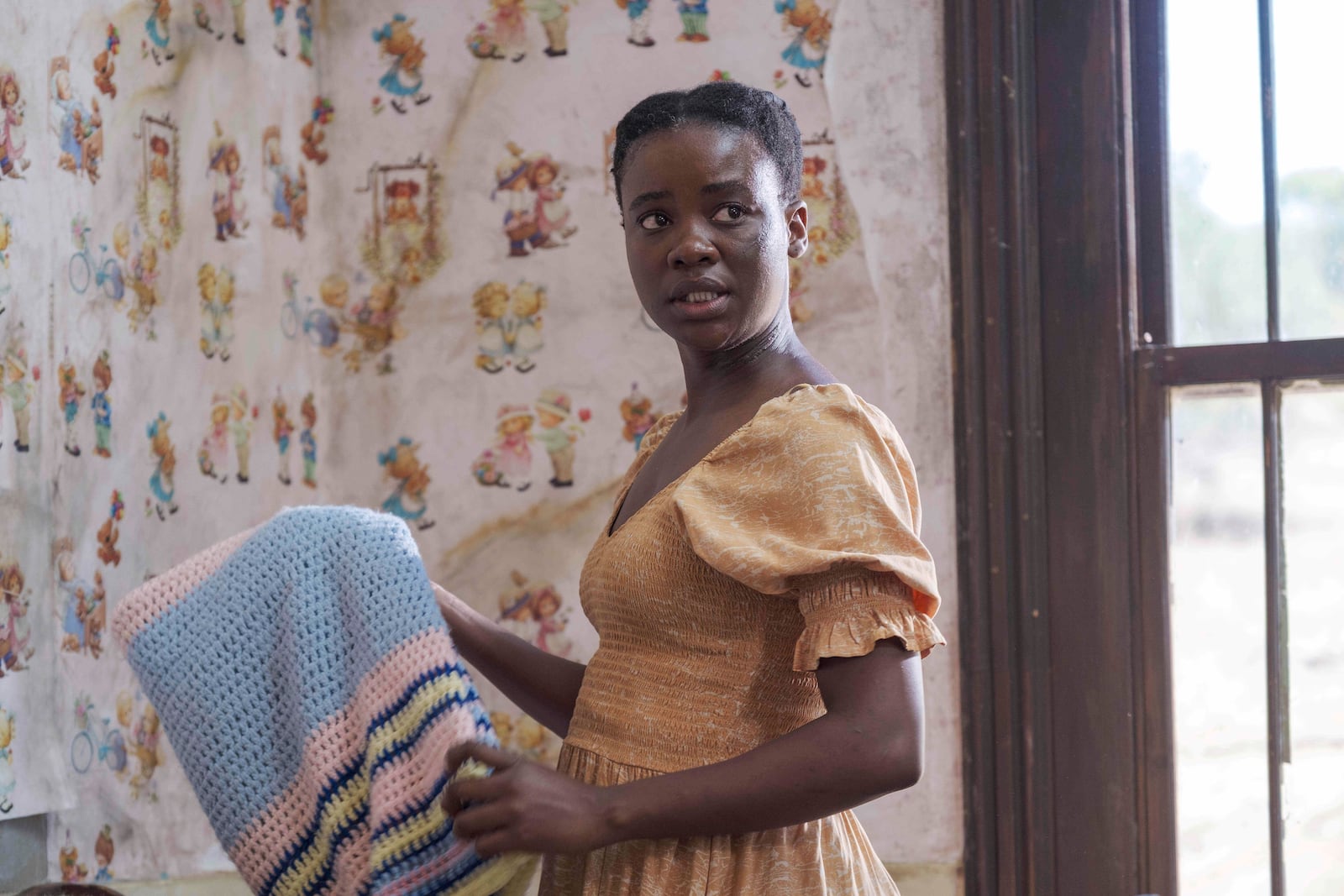 This image released by Sony Pictures Classics shows Zikhona Bali in a scene from "Don’t Let’s Go to the Dogs Tonight." (Coco Van Oppens/Sony Pictures Classics via AP)