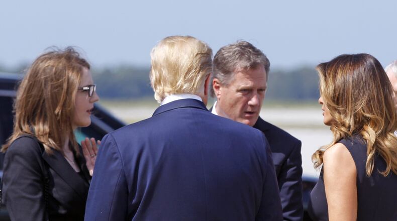 President Trump and First Lady Melania Trump greeted Congressman Mike Turner (R) and his daughter Jessic Turner at Wright-Patterson Air Force Base, on Aug. 7, 2019, in Dayton, Ohio. On Thursday, Turner said Trump’s conversation with the leader of Ukraine is disappointing but impeachment would be an “assault” on the electorate. (Ty Greenlees/Dayton Daily News/pool)