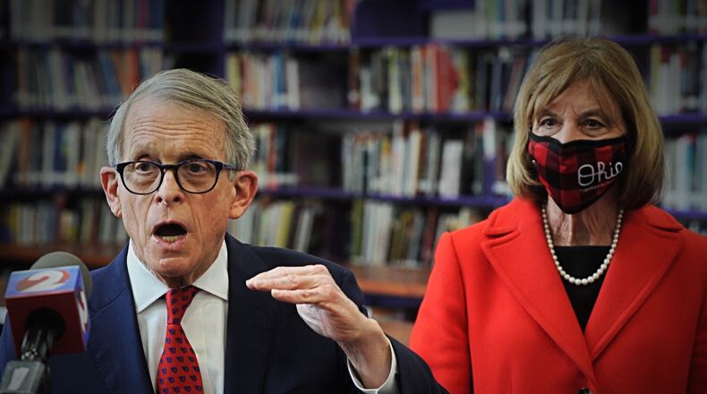 Gov. Mike DeWine addresses the media after touring a COVID-19 vaccination clinic at Thurgood Marshall High school in Dayton on Sunday. / Staff photo by Marshall Gorby