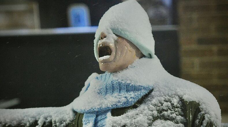 Snow and cold weather Friday morning Jan. 19, 2024, has even the mannequin in front of the Foy's store in Fairborn screaming. MARSHALL GORBY\STAFF