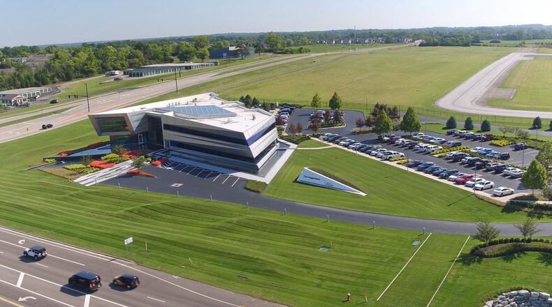 Zoning changes and FAA approvals have opened up City of Dayton land at the Dayton-Wright Brothers Airport for commercial and light industrial development. The open field past this corporate building owned by the Conner Group is one part of acreage approved for use. TY GREENLEES / STAFF