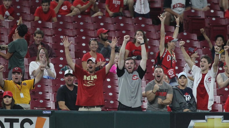 Reds fans cheer after a strikeout against the Angels on Tuesday, Aug. 6, 2019, at Great American Ball Park in Cincinnati. David Jablonski/Staff