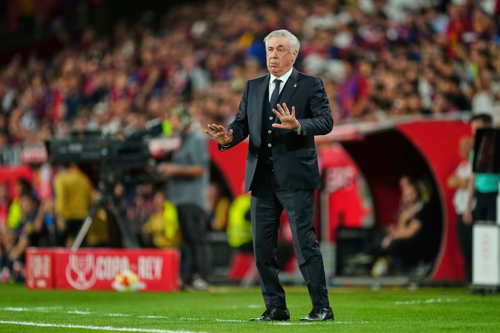 Real Madrid's head coach Carlo Ancelotti reacts during the Spanish Copa del Rey final soccer match between Barcelona and Real Madrid at Estadio de La Cartuja stadium in Seville, Spain, Saturday, April 26, 2025. (AP Photo/Jose Breton)