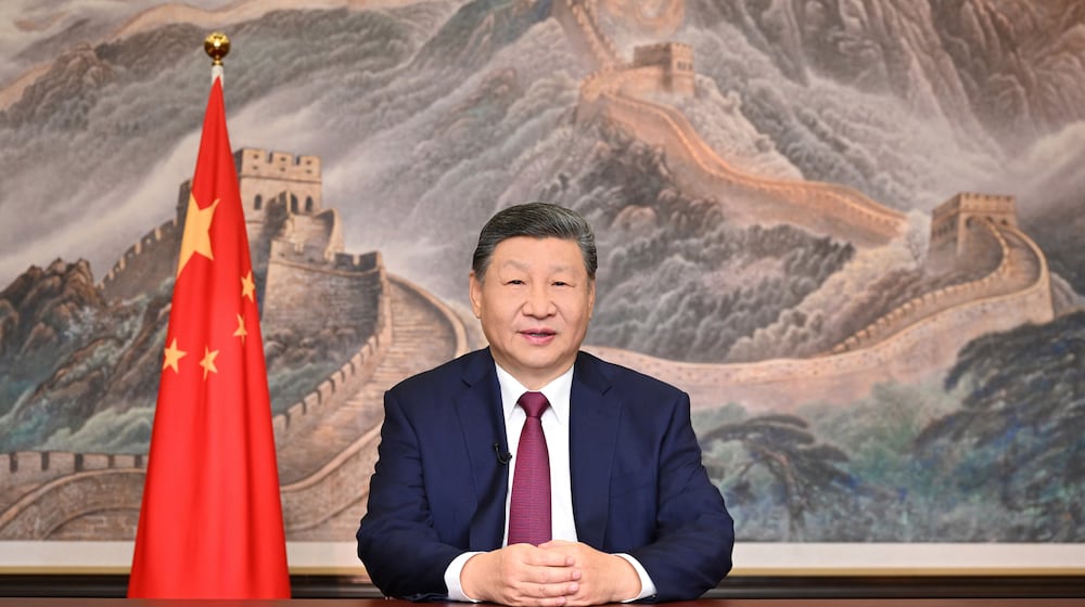 In this photo released by Xinhua News Agency, Chinese President Xi Jinping delivers his 2026 New Year message in Beijing on Wednesday, Dec. 31, 2025. (Yan Yan/Xinhua via AP)