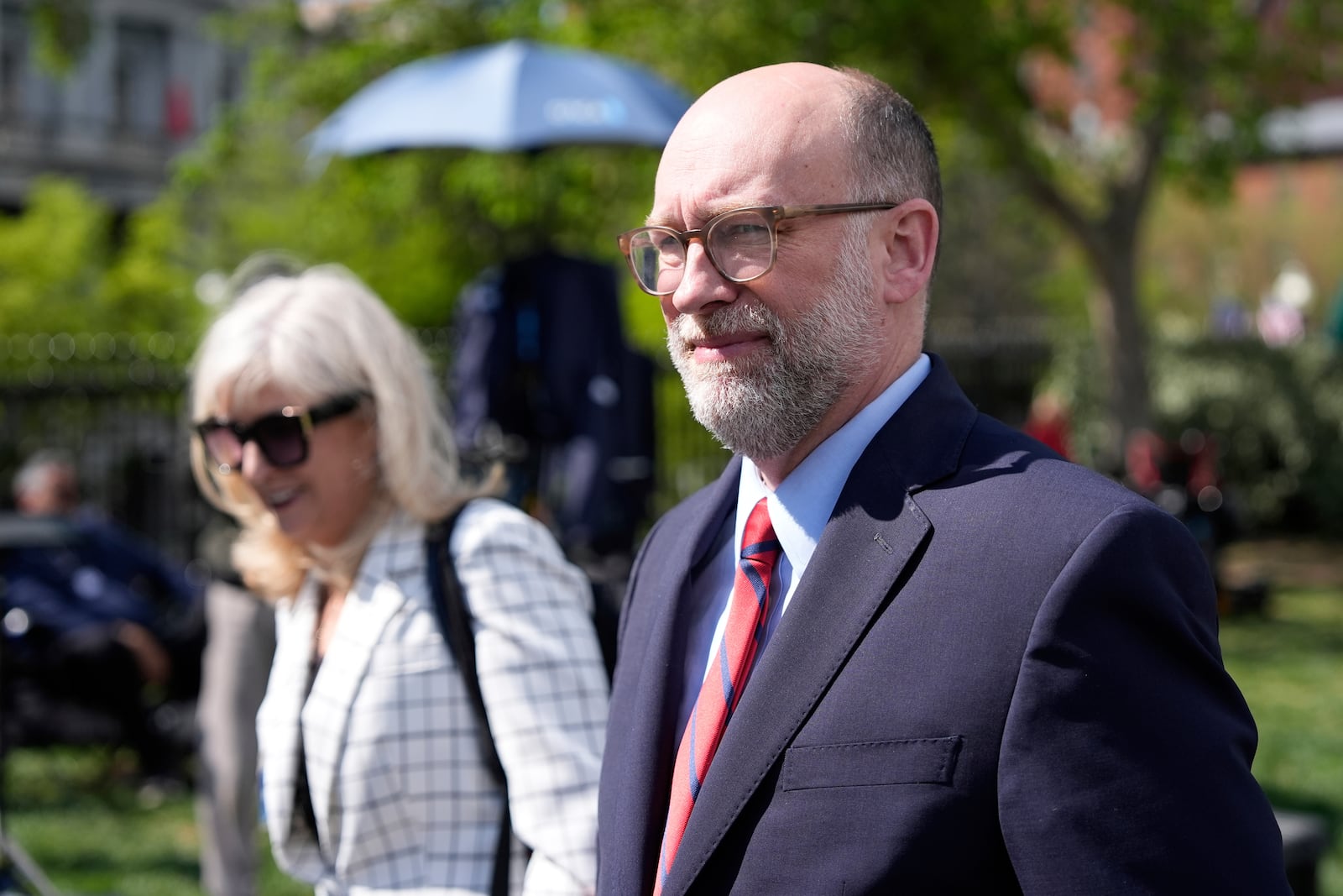 Office of Management and Budget director Russell Vought walks after a television interview at the White House, Tuesday, April 15, 2025, in Washington. (AP Photo/Alex Brandon)