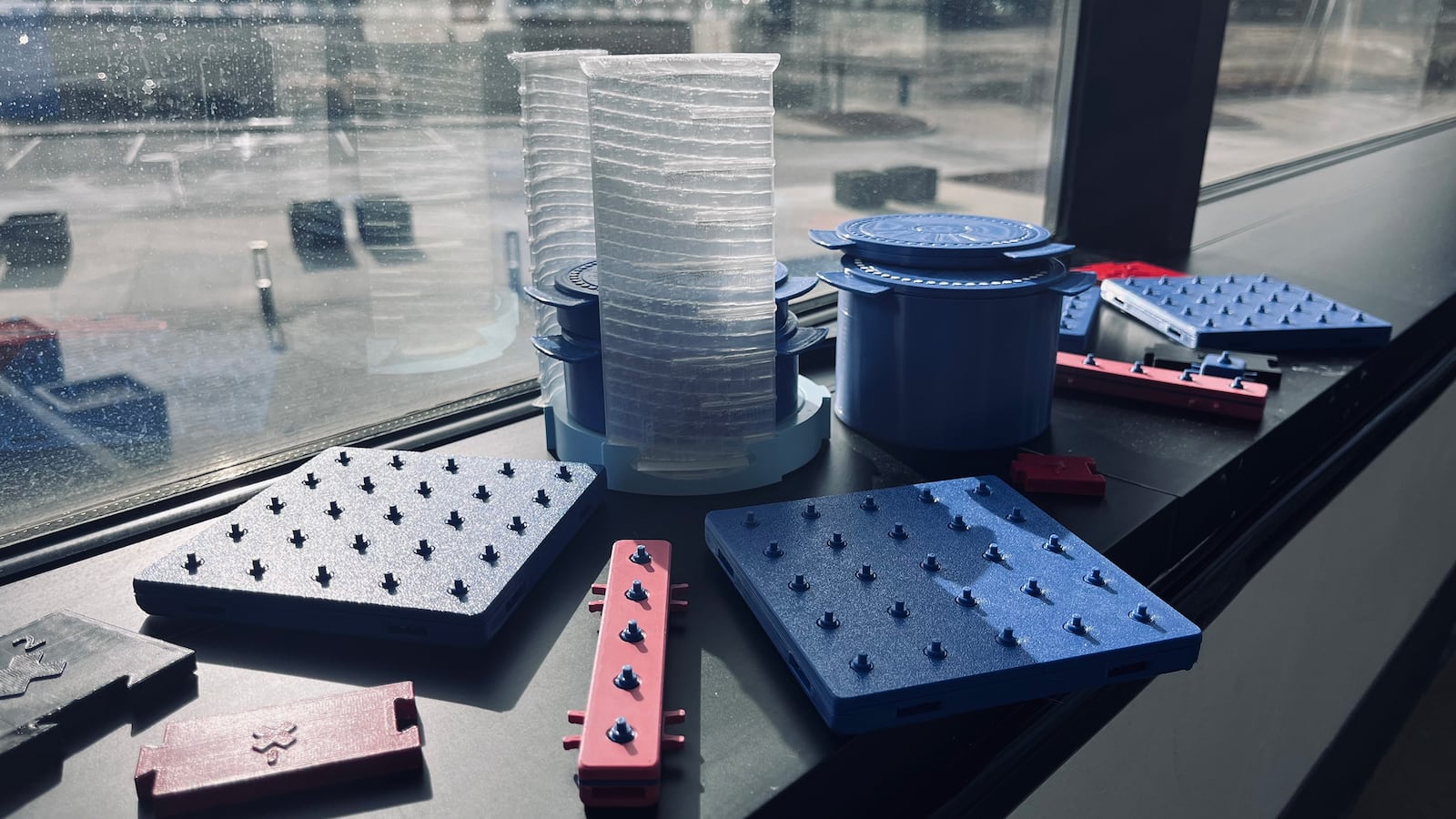 Jenna Stout won Cedarville University's first place at the Pitch, a shark-tank style entrepreneurial competition. Here, blue and red modular fraction aids sit displayed on a windowsill, showcasing Brightpond Designs’ innovative product prototypes. PHOTO BY JENNA STOUT, CEDARVILLE UNIVERSITY / CONTRIBUTED