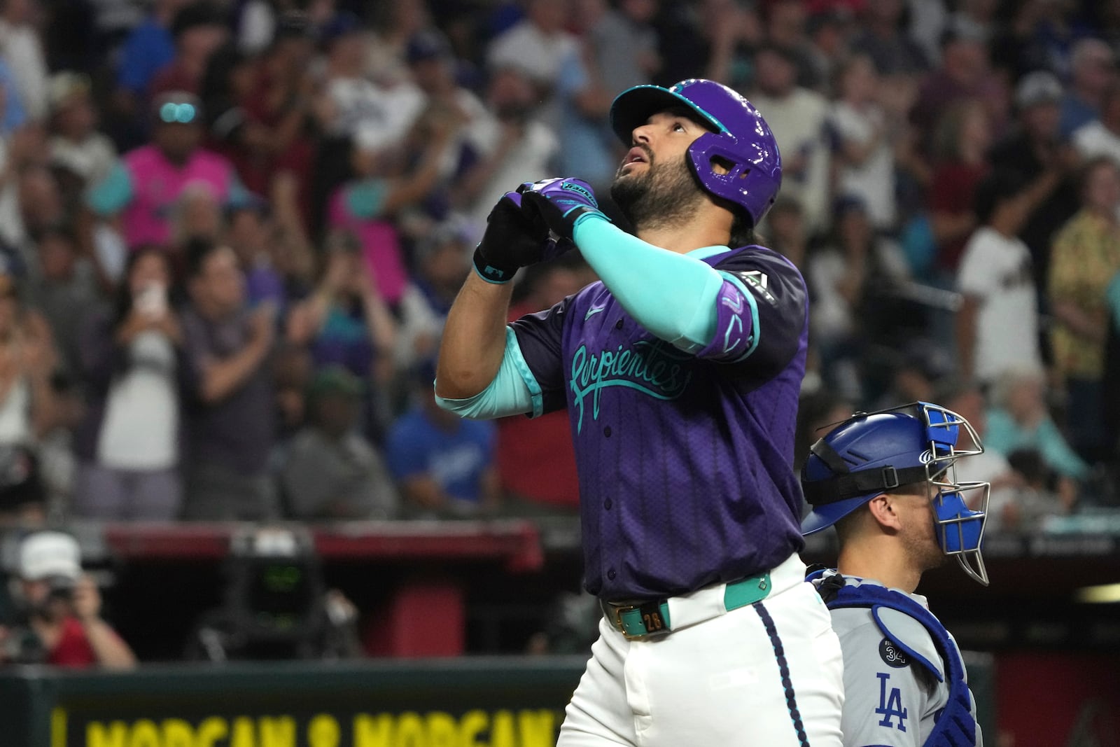 Arizona Diamondbacks' Eugenio Suárez reacts after hitting a solo home run against the Los Angeles Dodgers in the sixth inning during a baseball game, Saturday, May 10, 2025, in Phoenix. (AP Photo/Rick Scuteri)