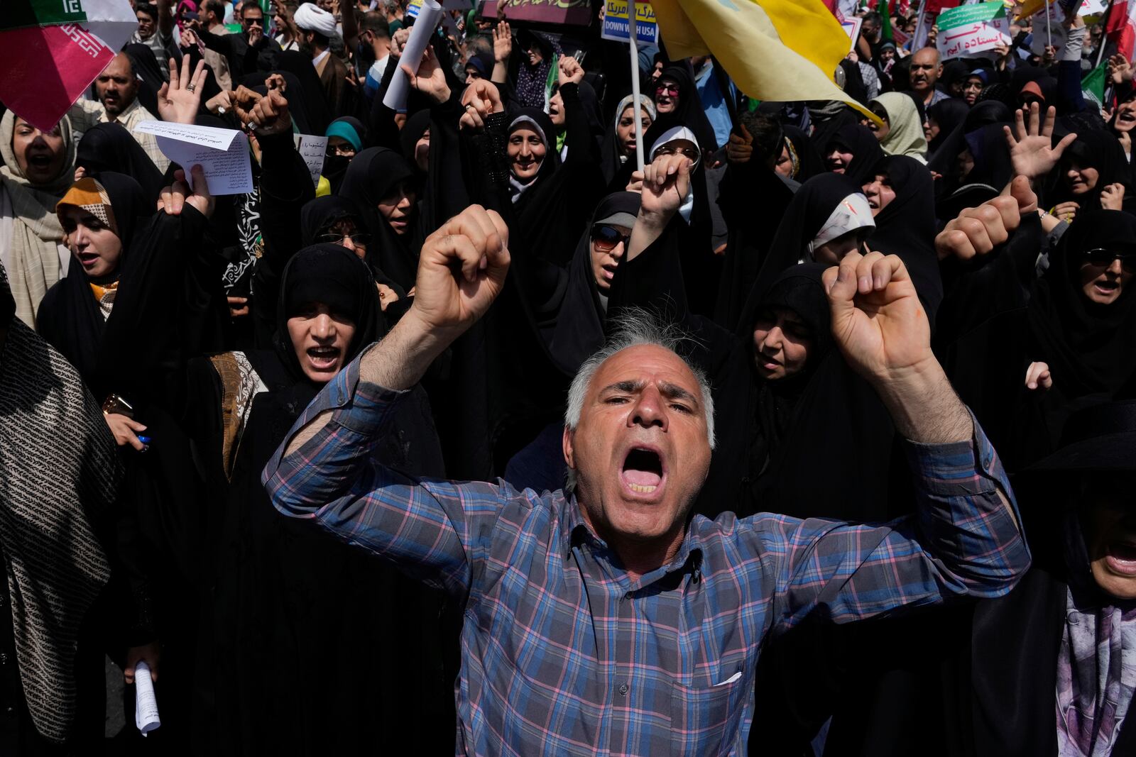 Iranian protesters chant slogans during a protest to condemn Israeli attacks on multiple cities across Iran, after the Friday prayers ceremony in Tehran, Iran, Friday, June 20, 2025. (AP Photo/Vahid Salemi)