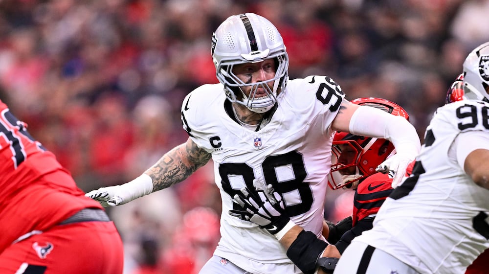 FILE - Las Vegas Raiders defensive end Maxx Crosby (98) rushes during the first half of an NFL football game against the Houston Texans, Dec. 21, 2025, in Houston. (AP Photo/Maria Lysaker, File)
