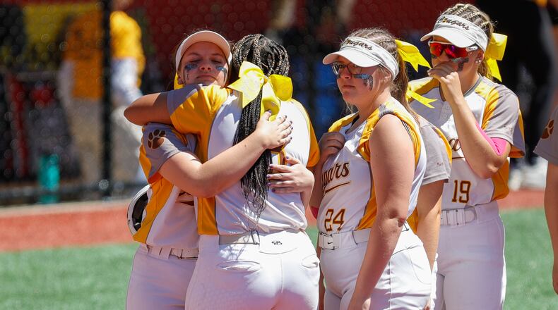 Kenton Ridge High School sophomore Cara Cammon (front) hugs senior Natalee Fyffe (rear) moments after the Cougars 3-0 loss to Canfield in a Division II state semifinal on Friday morning at Firestone Stadium in Akron. Michael Cooper/CONTRIBUTED