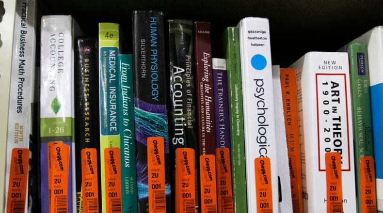 Textbooks sit on a shelf at the Chegg Inc. warehouse in Shepherdsville, Kentucky, U.S., on Thursday, April 29, 2010. No more $120 chemistry books. That’s the message from textbook-rental service Chegg Inc., which is urging college students to stop paying top dollar to buy their tomes. Photographer: John Sommers II/Bloomberg via Getty Images