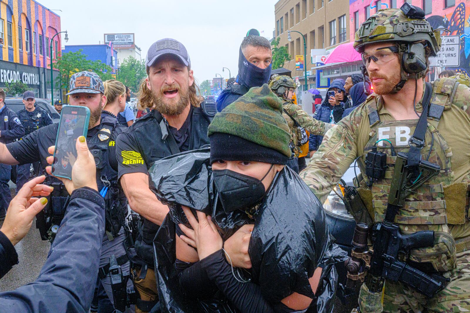 Community protesters confront law enforcement officers as federal agents conduct an operation in Minneapolis, on Tuesday, June 3, 2025. (Kerem Yücel/Minnesota Public Radio via AP)