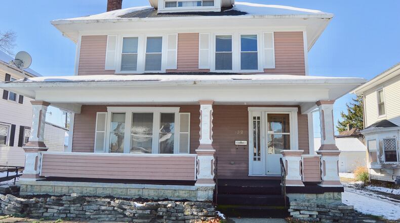 The 4-bedroom home offers about 2,580 sq. ft. of living space and has a variety of original features. The home also includes a covered front porch and detached, 2-car garage. CONTRIBUTED PHOTO