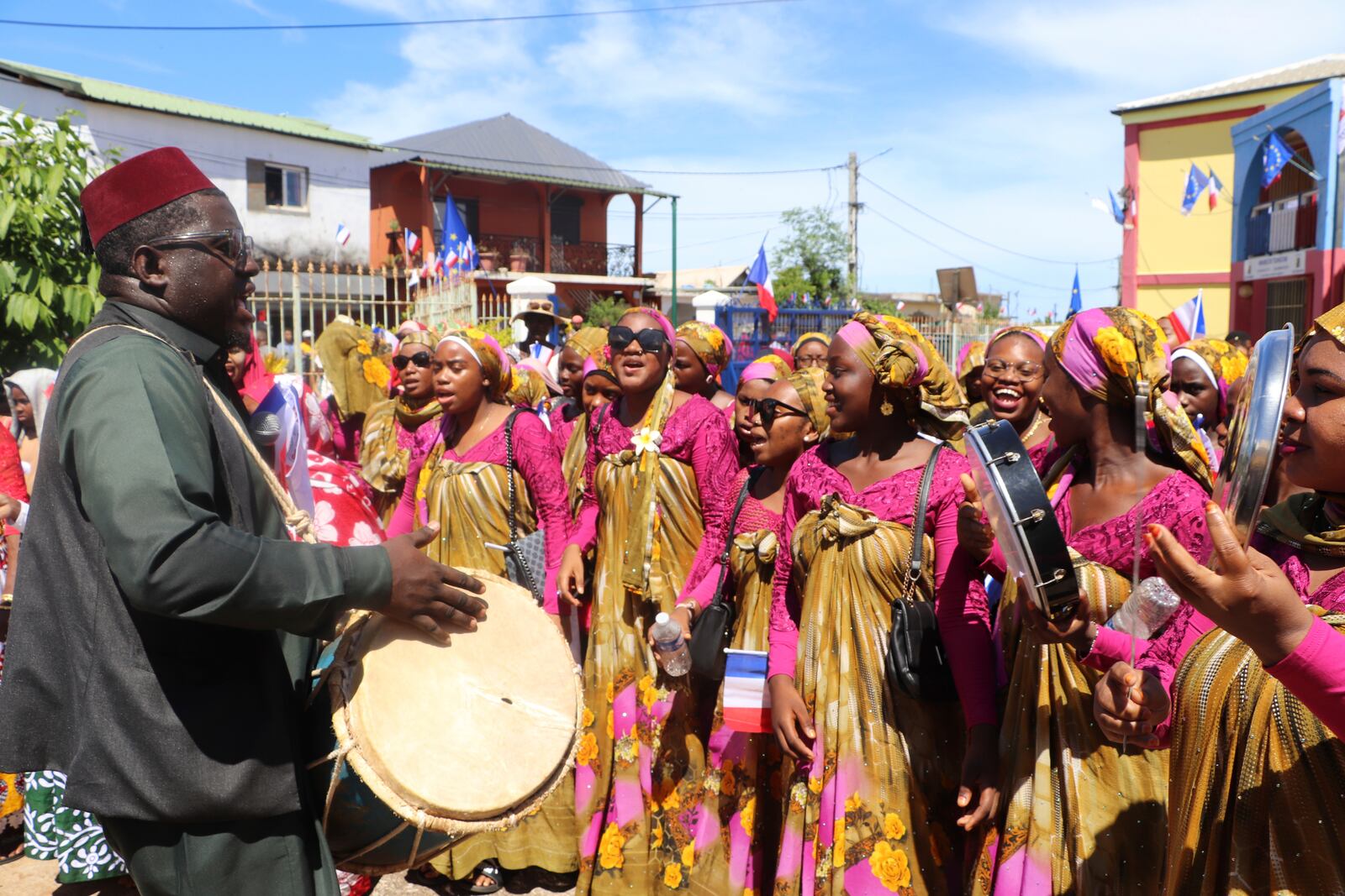 A group of singers and dancers perform after French President Emmanuel Macron's visit Monday, April 21, 2025 in Tsingoni , Mayotte island, in the Indian Ocean French territory of Mayotte. (AP Photo/Alexis Duclos)