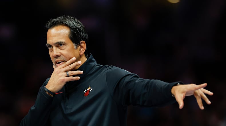 Miami Heat head coach Erik Spoelstra directs his team during the first half of an NBA basketball game against the Charlotte Hornets in Charlotte, N.C., Friday, March 6, 2026. (AP Photo/Nell Redmond)