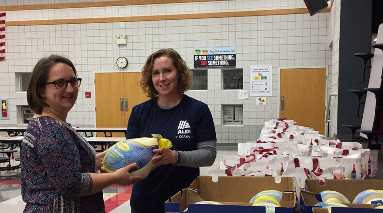Springfield Promise Neighborhood gave away 150 Thanksgiving meals to local residents. ERIC HIGGENBOTHAM/STAFF