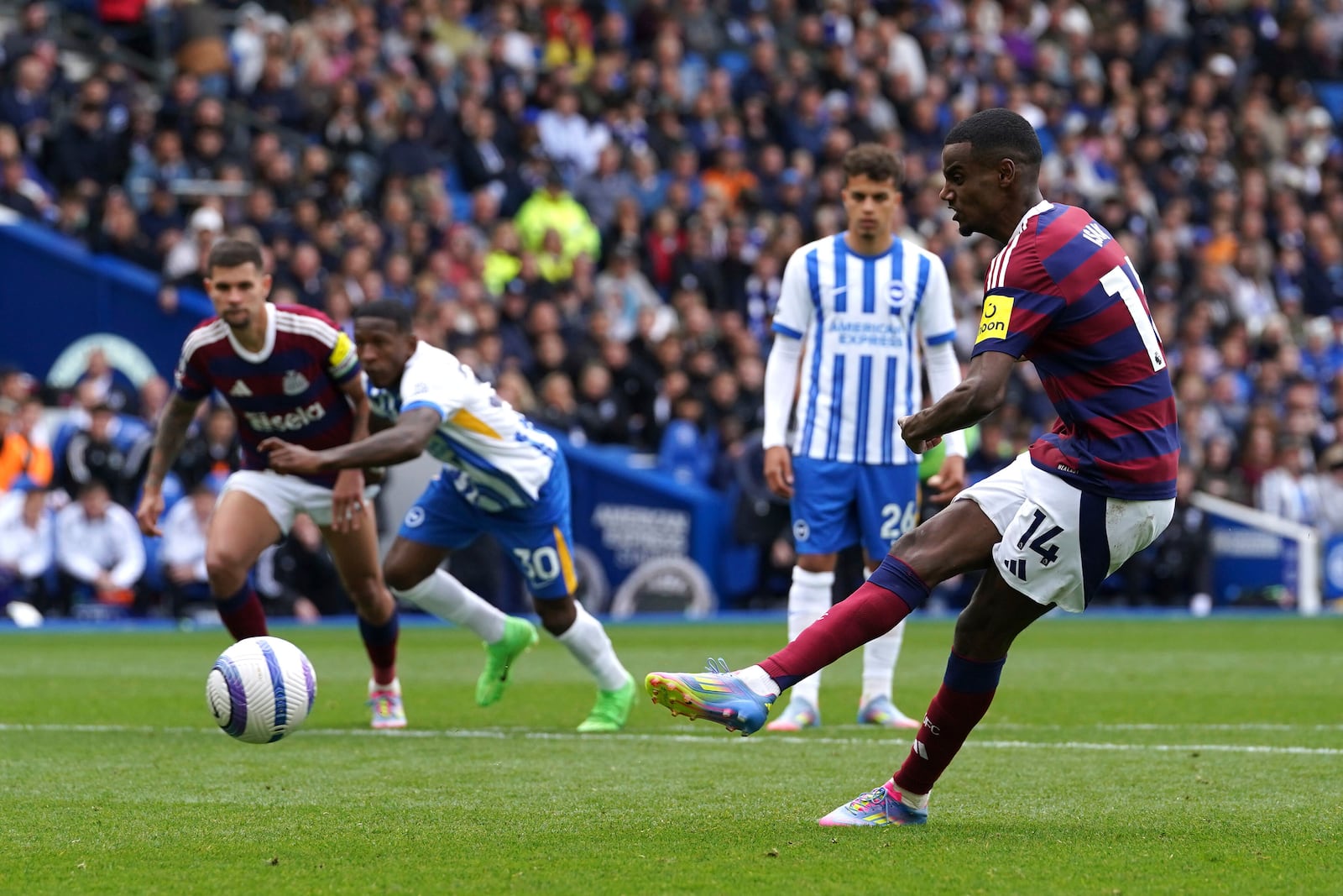 Newcastle United's Alexander Isak scores their side's first goal of the game from the penalty spot during the English Premier League soccer match between Brighton and Hove Albion and Newcastle United in Brighton and Hove, England, Sunday, May 4, 2025. (Gareth Fuller/PA via AP)