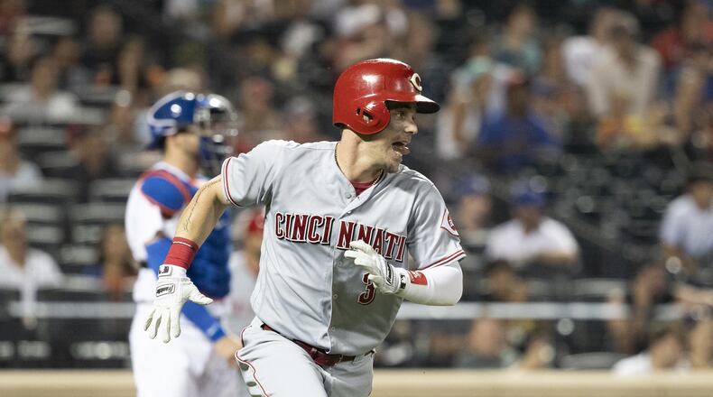 NEW YORK, NY - AUGUST 07: Scooter Gennett #3 of the Cincinnati Reds runs to first base after hitting a single bringing Jose Peraza #9 of the Cincinnati Reds home in the first inning against the New York Mets at Citi Field on August 7, 2018 in the Flushing neighborhood of the Queens borough of New York City. (Photo by Michael Owens/Getty Images)