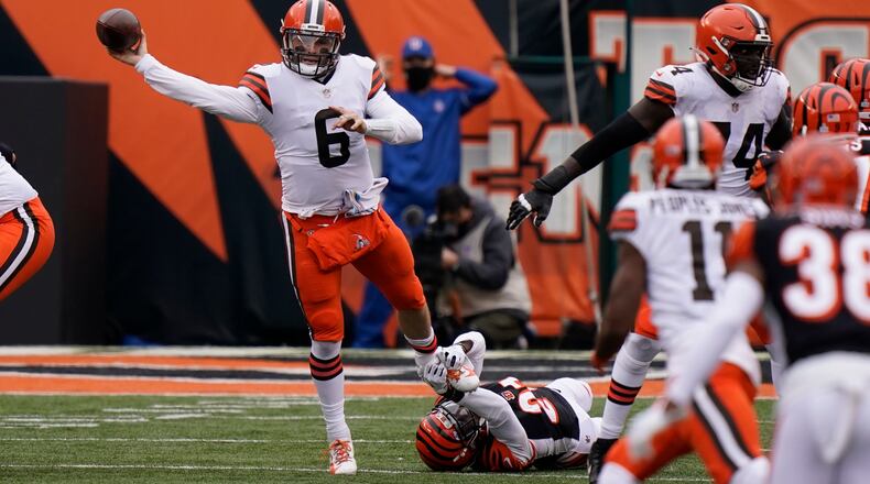Cleveland Browns quarterback Baker Mayfield (6) throws during the second half of an NFL football game against the Cincinnati Bengals, Sunday, Oct. 25, 2020, in Cincinnati. (AP Photo/Bryan Woolston)