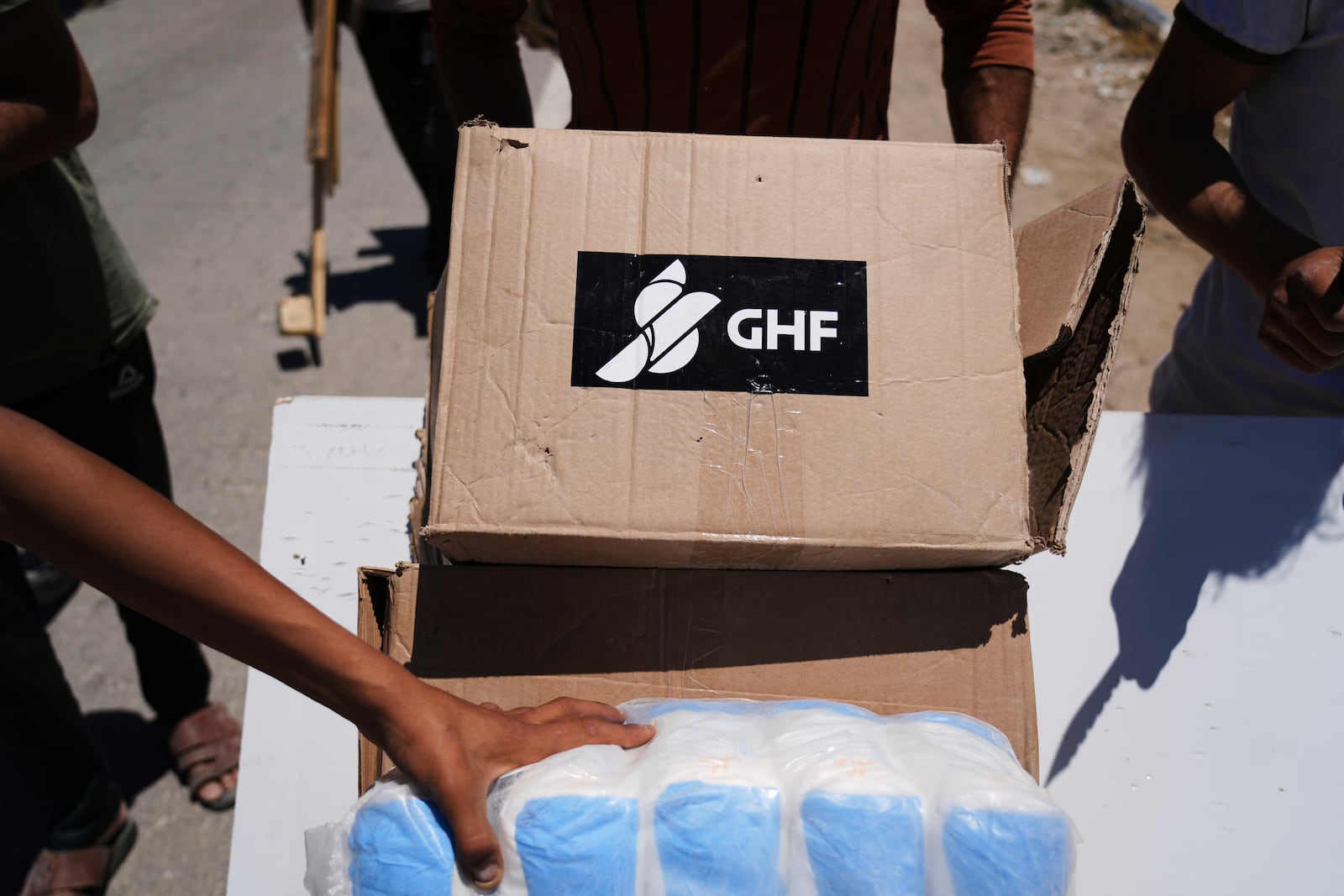 FILE - Boxes and bags of humanitarian aid delivered by the Gaza Humanitarian Foundation, a U.S.-backed organization approved by Israel, are seen in Khan Younis, southern Gaza Strip, on May 29, 2025. (AP Photo/Abdel Kareem Hana, File)