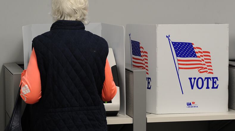 In this file photo a woman votes early at the Montgomery County Board of Elections Thursday Oct. 28, 2021. In May 2024 Ohio Secretary of State Frank LaRose announced he'll be removing the names of "inactive" voters from the state's voter registration rolls. MARSHALL GORBY\STAFF