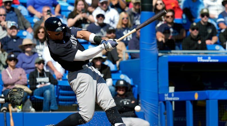 New York Yankees' Aaron Judge connects for a single off Toronto Blue Jays pitcher Jesse Hahn during the fifth inning of a spring training baseball game Tuesday, Feb. 24, 2026, in Dunedin, Fla. (AP Photo/Chris O'Meara)