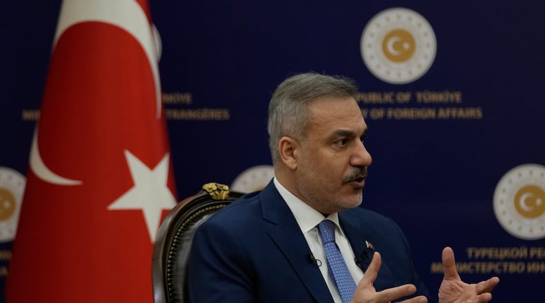 Turkey's Foreign Minister Hakan Fidan speaks during an interview with The Associated Press, in Ankara, Turkey, Saturday, March 14, 2026. (AP Photo/Khalil Hamra)