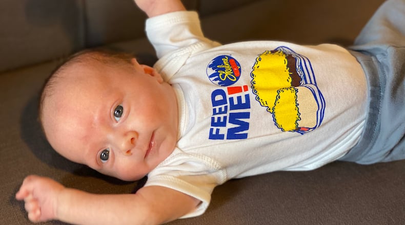A baby with a Skyline Chili shirt