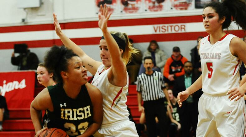 Freshman Abbigail Peterson (with ball), Catholic Central’s leading scorer with 16 points per game, has helped the Irish resurgence in girls basketball. GREG BILLING / CONTRIBUTED