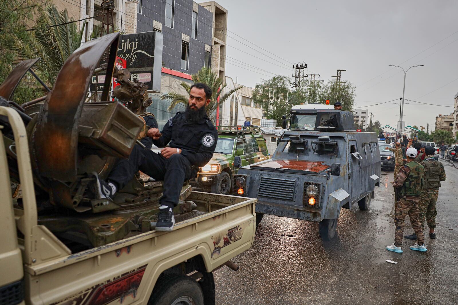 Members of Syria's security forces deploy in the town of Sahnaya, south of Damascus, on Wednesday, April 30, 2025, after earlier clashes with Druze fighters left at least 11 people dead. (AP Photo/Omar Albam)